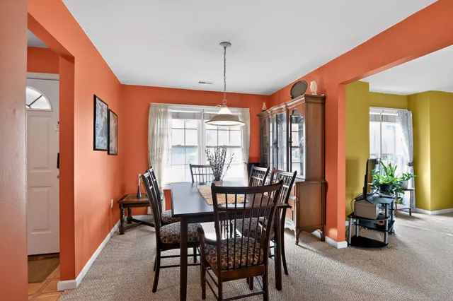 a view of a dining room with furniture window and outside view