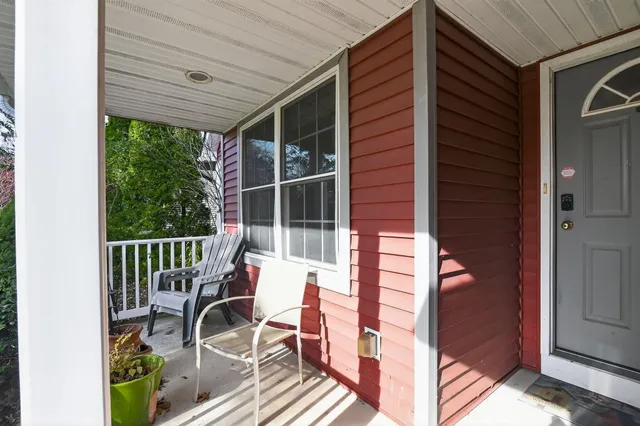 a view of balcony with wooden floor and outdoor seating