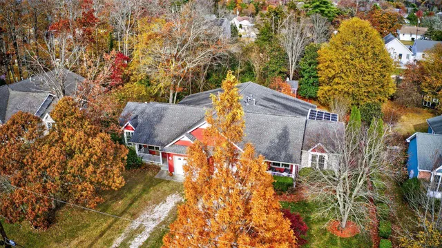 an aerial view of houses with yard