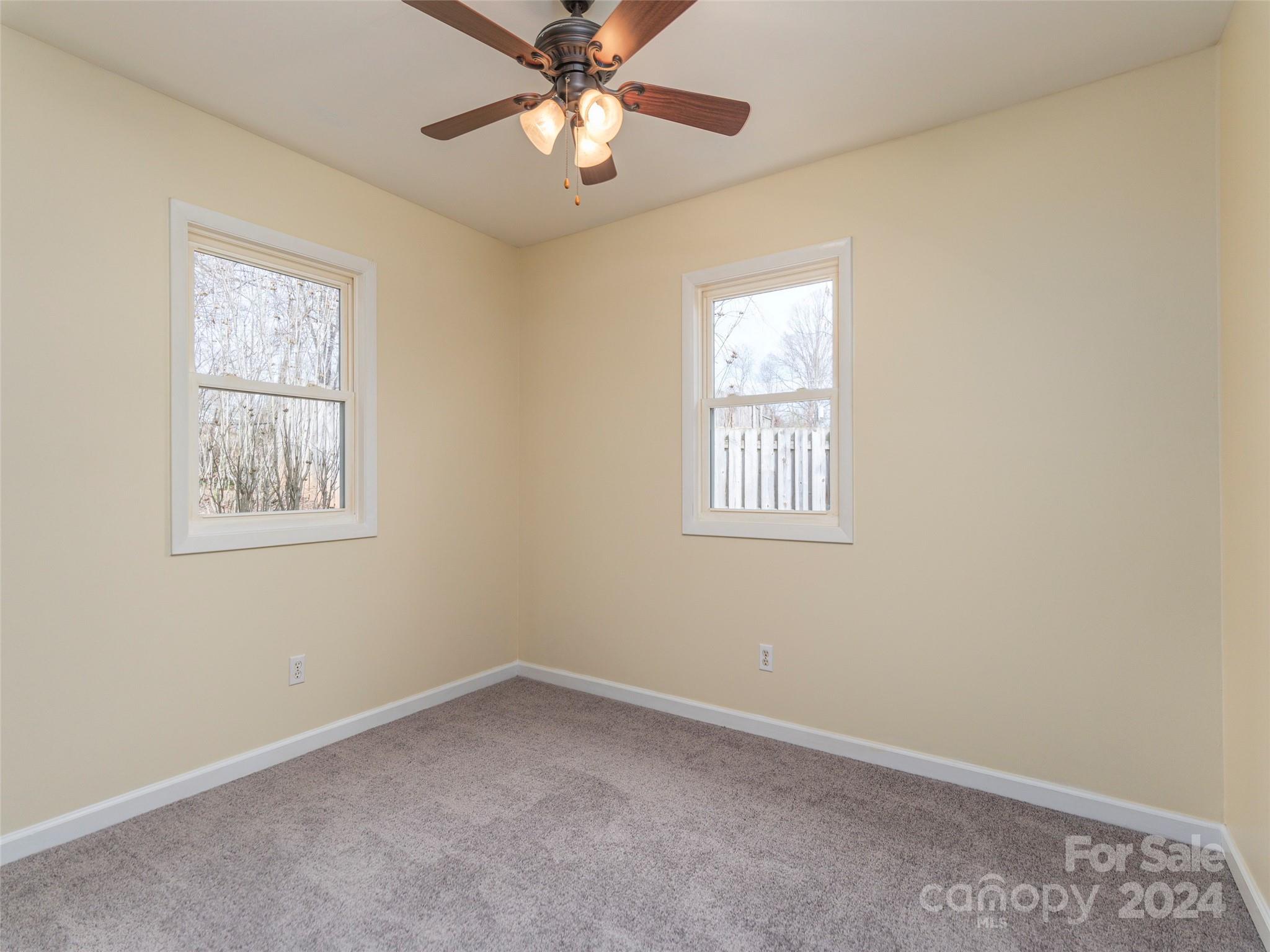 40 Wagon Road Asheville, NC 28805 - Photo 14 of 29 an empty room with windows and fan