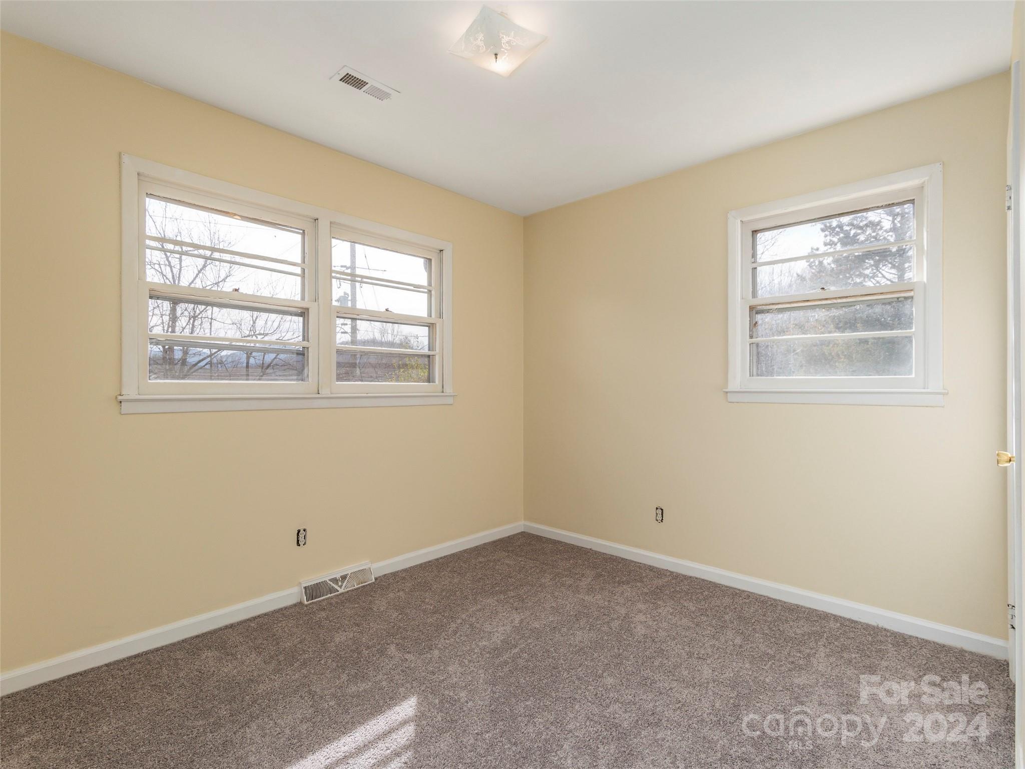 40 Wagon Road Asheville, NC 28805 - Photo 19 of 29 an empty room with windows