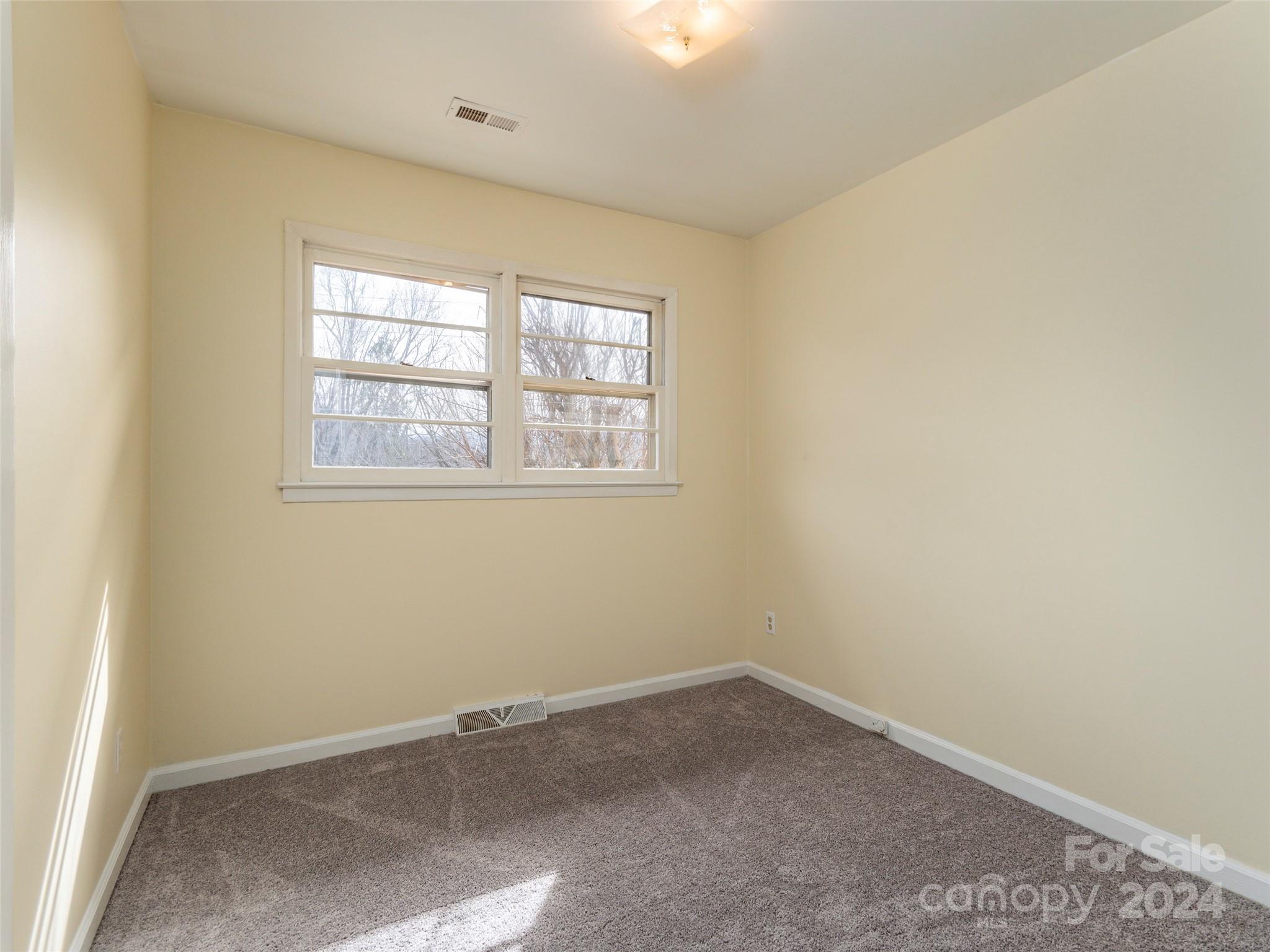 40 Wagon Road Asheville, NC 28805 - Photo 21 of 29 an empty room with a window