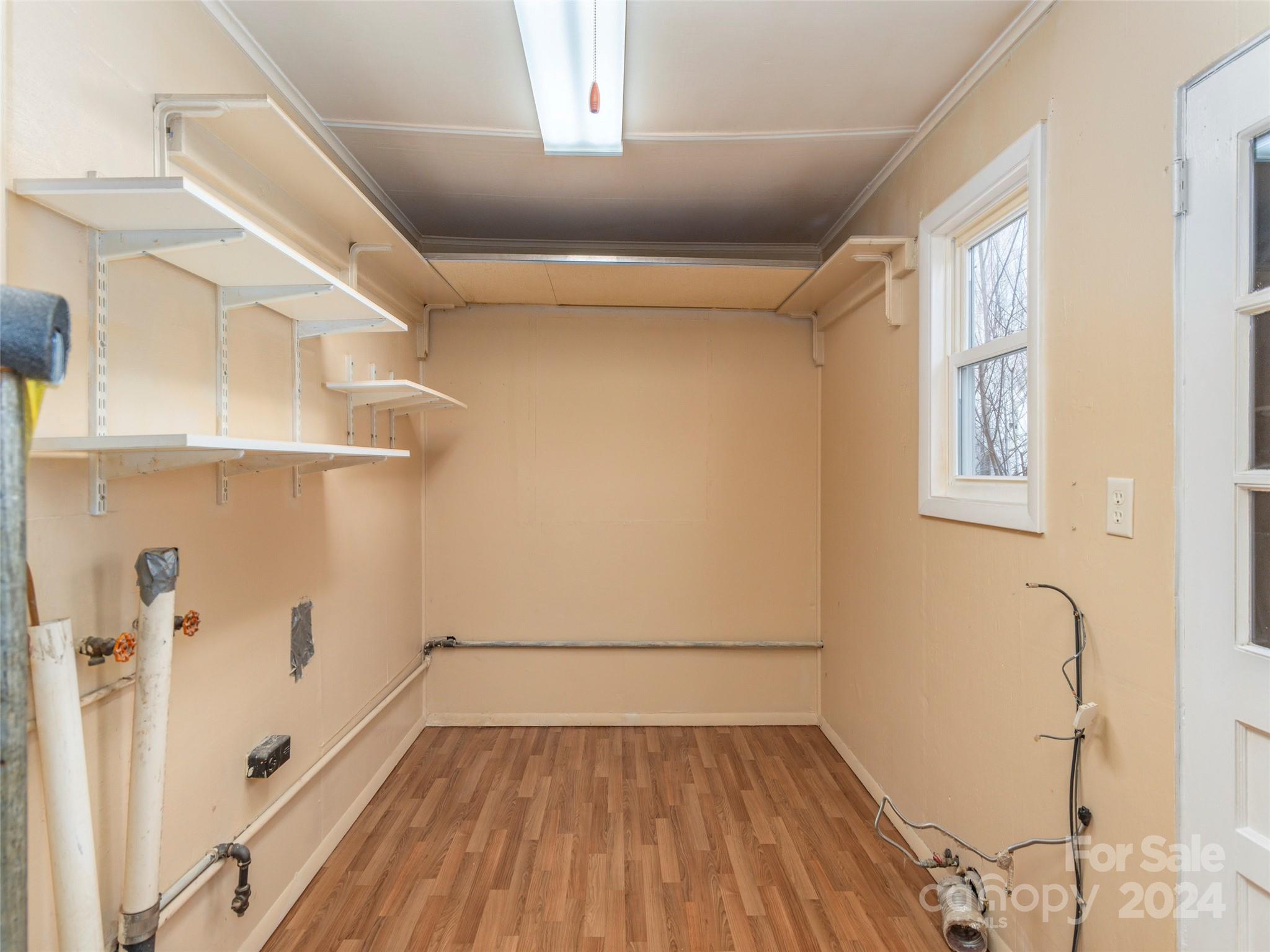 40 Wagon Road Asheville, NC 28805 - Photo 9 of 29 a view of a room with wooden floor and white walls