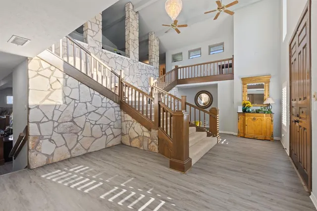 a view of entryway and hall with wooden floor