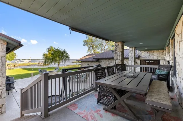 a view of a swimming pool and lounge chairs