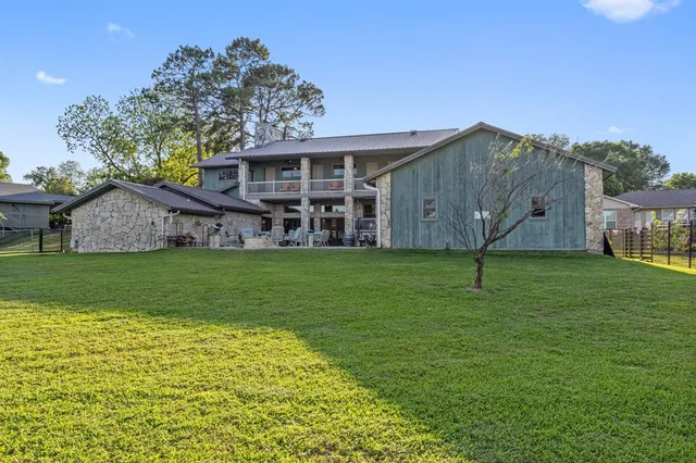 a view of a patio with a table chairs and a backyard