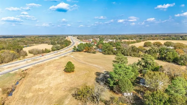 a view of a yard with trees