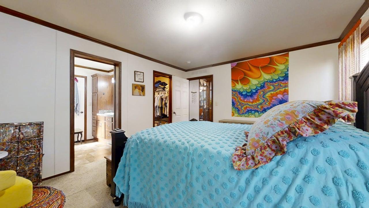 612 Bureau Court Mahomet, IL 61853 - Photo 14 of 27 a bed sitting in a bedroom next to a painting on the wall