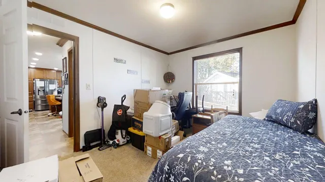a bedroom with two beds and a window