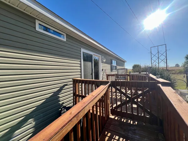 a view of balcony with furniture