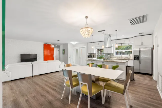 a kitchen with a stove sink and cabinets