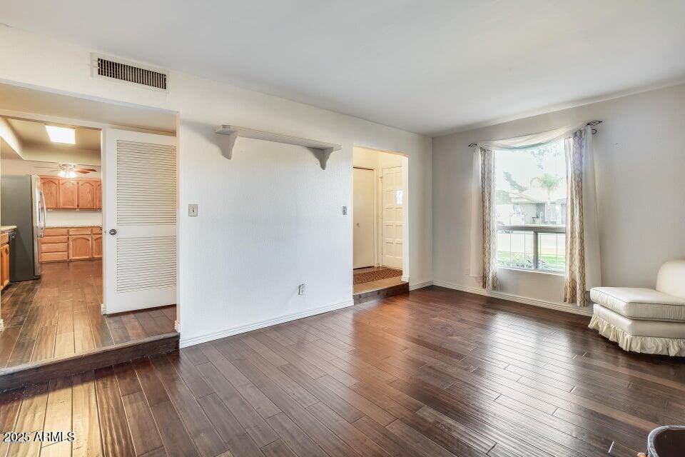 3527 West Yucca Street Phoenix, AZ 85029 - Photo 6 of 20 a view of a livingroom with wooden floor and a large window