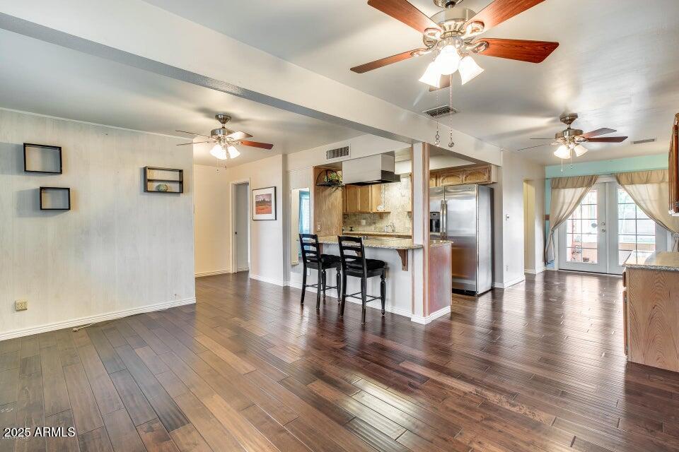 3527 West Yucca Street Phoenix, AZ 85029 - Photo 8 of 20 a view of a livingroom with furniture wooden floor a chandelier