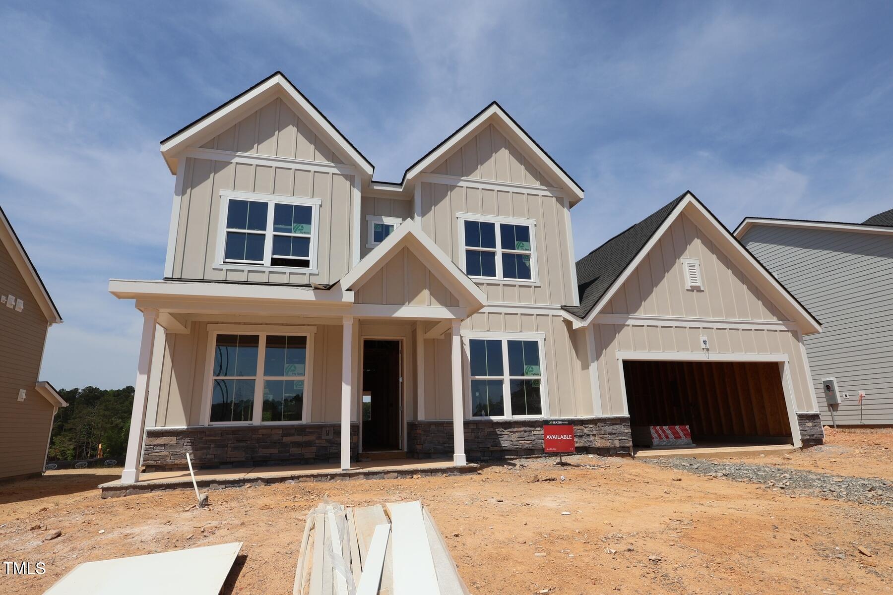 1204 Opal Lane, Unit 93 Durham, NC 27705 - Photo 1 of 7 a front view of a house with a yard