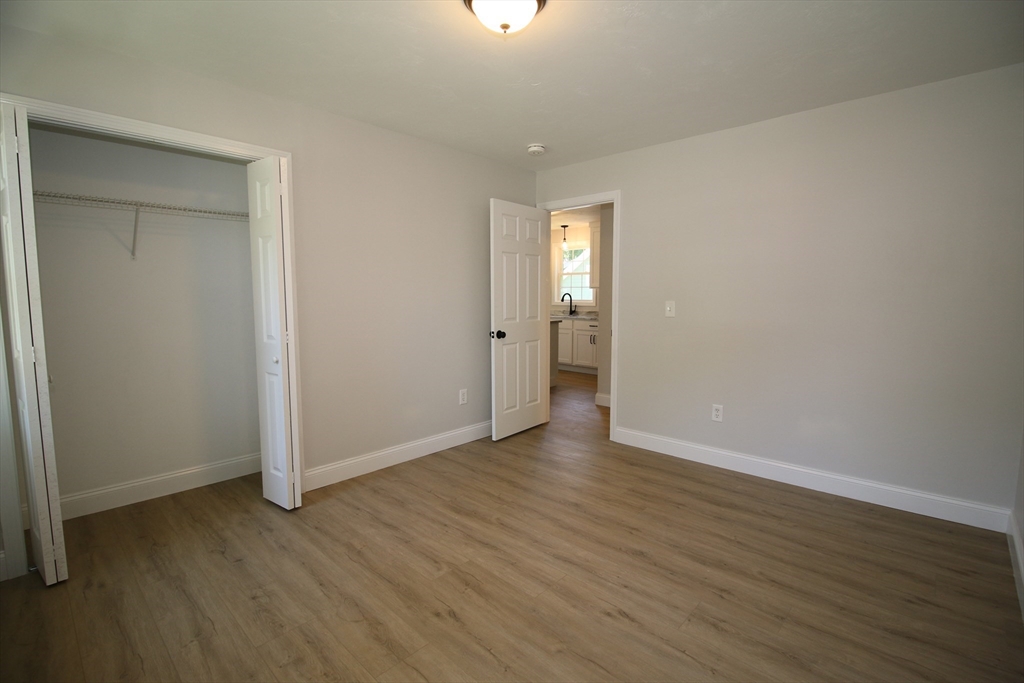 110 St Louis Street Worcester, MA 01607 - Photo 12 of 34 a view of an empty room with wooden floor