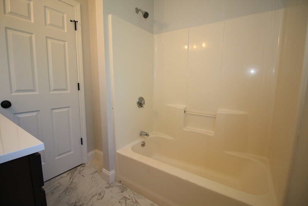 110 St Louis Street Worcester, MA 01607 - Photo 25 of 34 a bathroom with a bathtub and a shower
