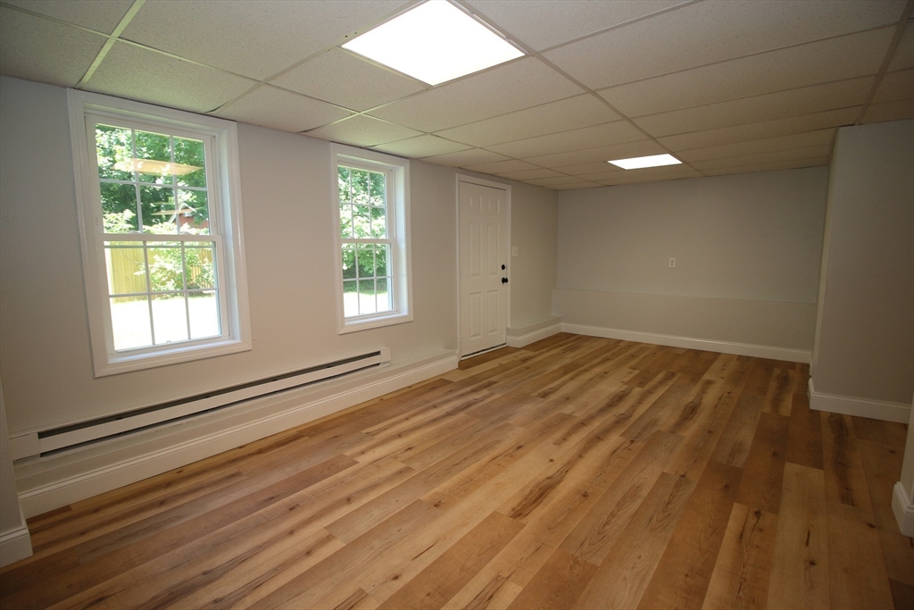 110 St Louis Street Worcester, MA 01607 - Photo 26 of 34 a view of empty room with wooden floor and fan