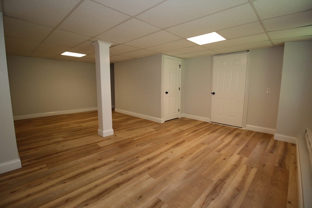 110 St Louis Street Worcester, MA 01607 - Photo 27 of 34 a view of an empty room and wooden floor