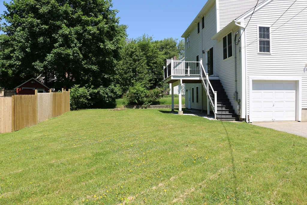 110 St Louis Street Worcester, MA 01607 - Photo 32 of 34 a view of a big house with a big yard and large trees