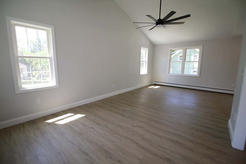 110 St Louis Street Worcester, MA 01607 - Photo 7 of 34 a view of an empty room with wooden floor and a window