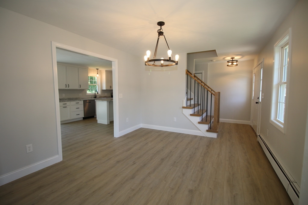 110 St Louis Street Worcester, MA 01607 - Photo 8 of 34 a view of a hallway view with wooden floor and staircase