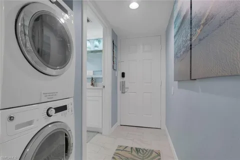 a bathroom with a bathtub shower sink vanity and toilet