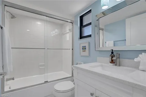 a view of balcony with a table and chairs