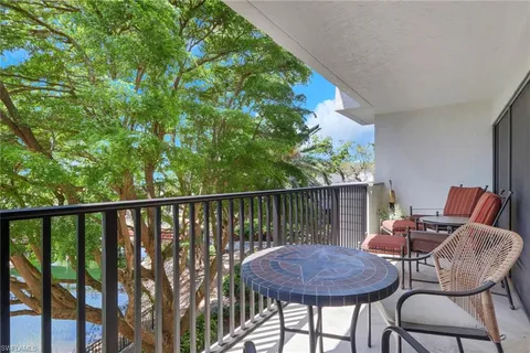 a balcony with a potted plant