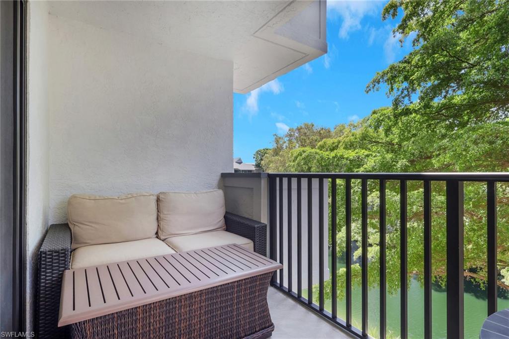 600 Neapolitan Way, Unit 357 Naples, FL 34103 - Photo 23 of 25 a balcony with a potted plant