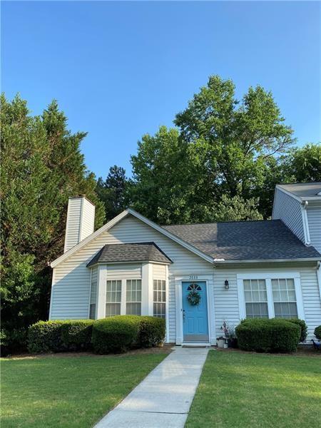 2888 Dresden Square Drive Chamblee, GA 30341 - Photo 1 of 1 a front view of a house with a garden