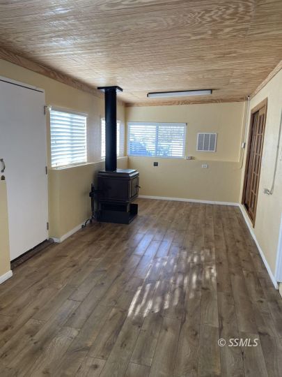 337 Peg Street Ridgecrest, CA 93555 - Photo 25 of 33 a view of empty room with wooden floor and fan