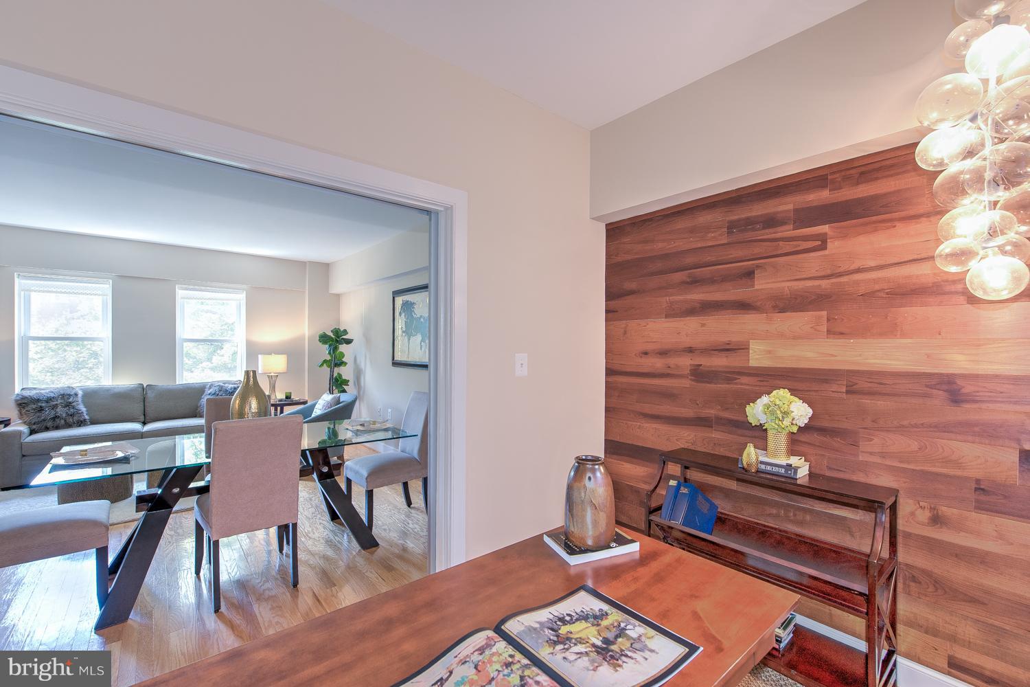 1727 R Street Northwest, Unit 202 Washington, DC 20009 - Photo 15 of 24 a view of a workspace with furniture and wooden floor