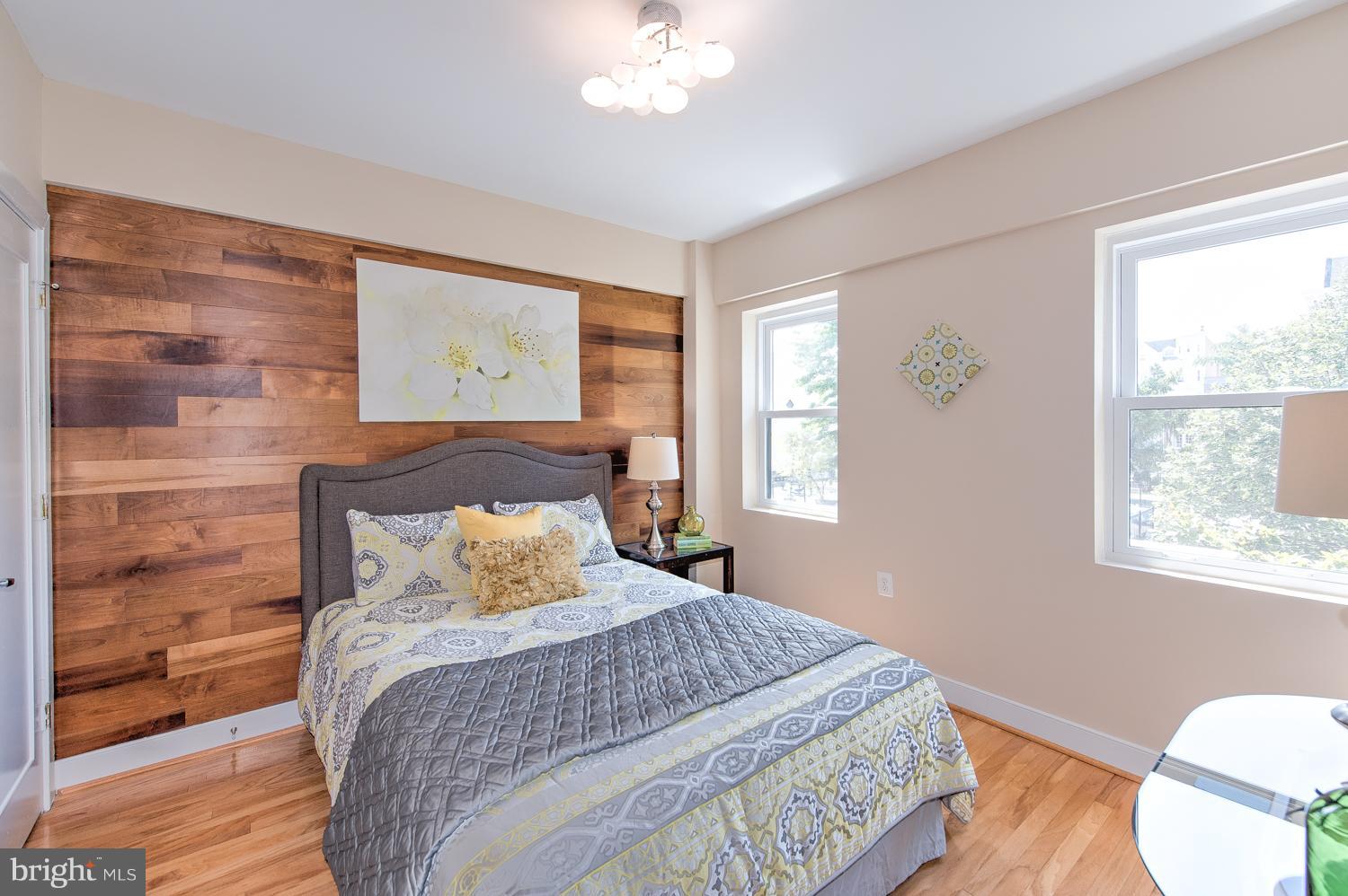 1727 R Street Northwest, Unit 202 Washington, DC 20009 - Photo 17 of 24 a bedroom with a large bed and a window