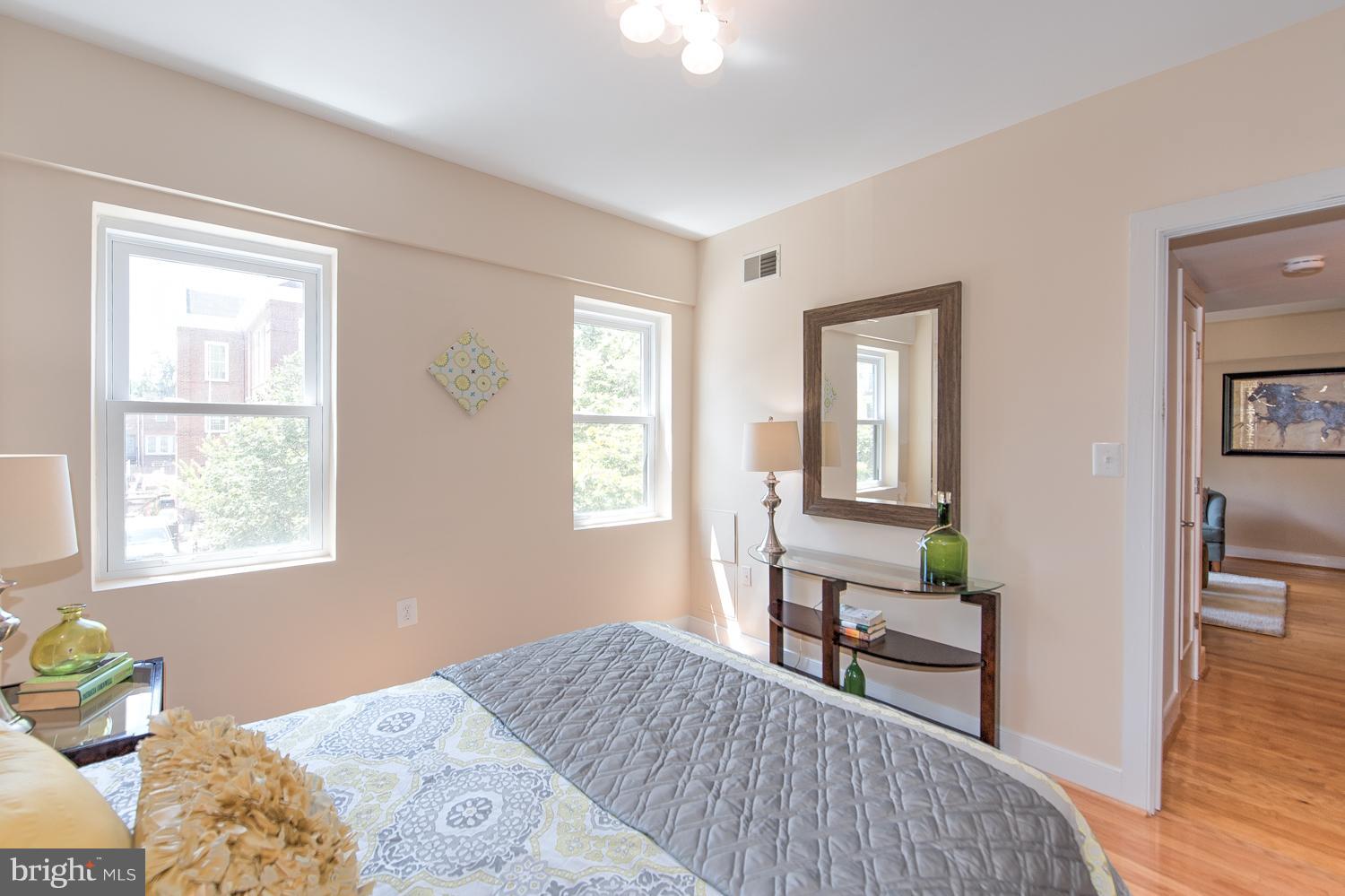 1727 R Street Northwest, Unit 202 Washington, DC 20009 - Photo 18 of 24 a bedroom with a bed and a window