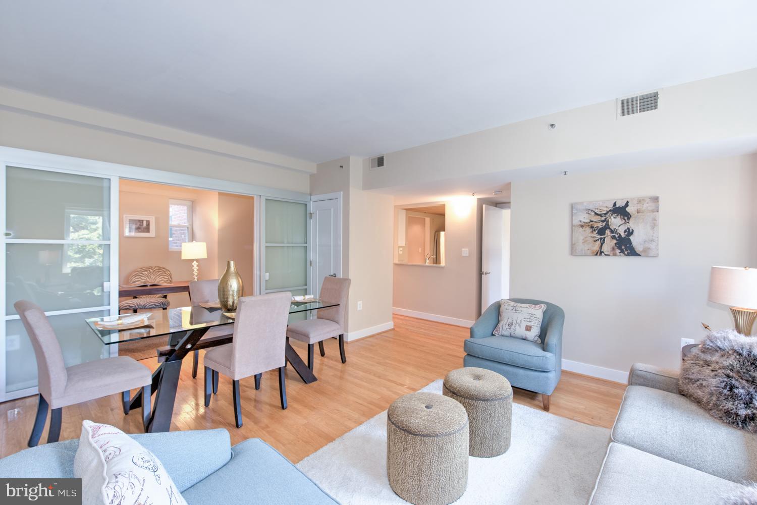 1727 R Street Northwest, Unit 202 Washington, DC 20009 - Photo 9 of 24 a living room with furniture and wooden floor