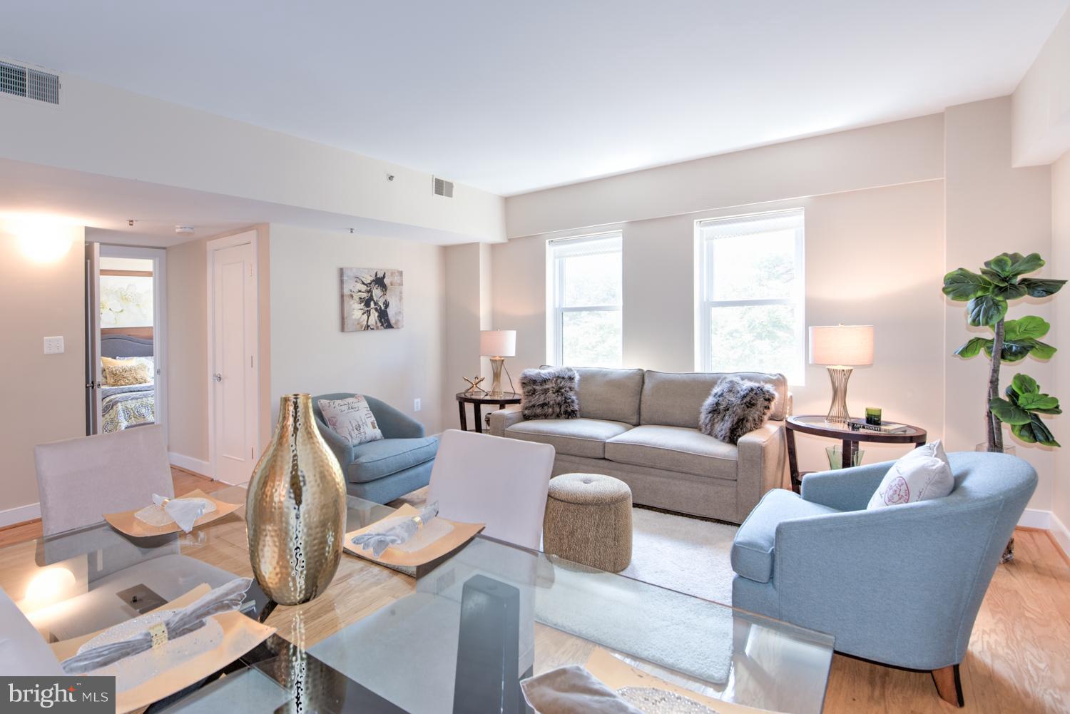 1727 R Street Northwest, Unit 202 Washington, DC 20009 - Photo 10 of 24 a living room with furniture and wooden floor