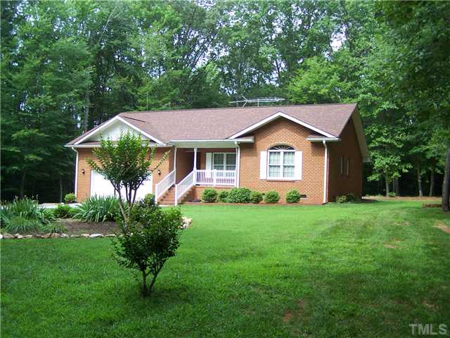 448 Lewis Road Clarksville, VA 23927 - Photo 1 of 12 Shows the front of the property as well as the nice front lawn and landscaping.