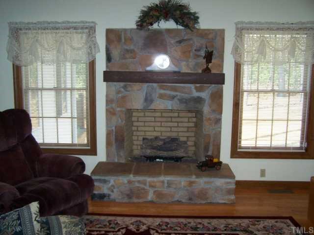 448 Lewis Road Clarksville, VA 23927 - Photo 4 of 12 The beautiful rock fireplace has propane gas logs, but is a full masonry fireplace allowing you to have wood fires rather than the gas logs.