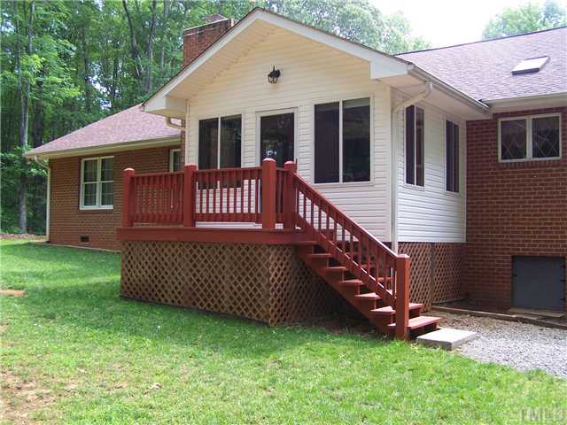 448 Lewis Road Clarksville, VA 23927 - Photo 6 of 12 The large sunroom on the back of the house will provide a very pleasant place to enjoy the afternoons and evenings overlooking the wooded back yard. Also, note the deck if you wish to be outside.