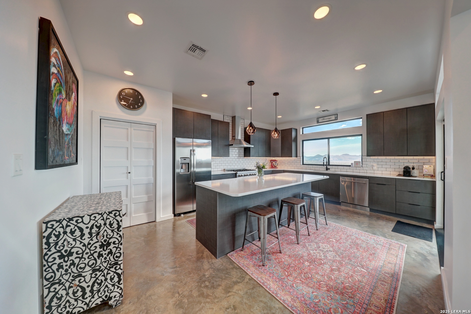 28 Scenic Ridge Road South Alpine, TX 79830 - Photo 12 of 48 a large kitchen with stainless steel appliances kitchen island granite countertop a sink and cabinets