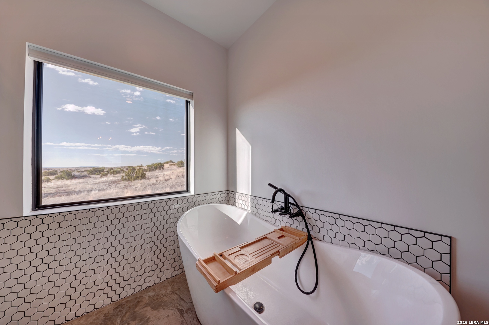 28 Scenic Ridge Road South Alpine, TX 79830 - Photo 18 of 48 a glass shower door with glass top table and chair