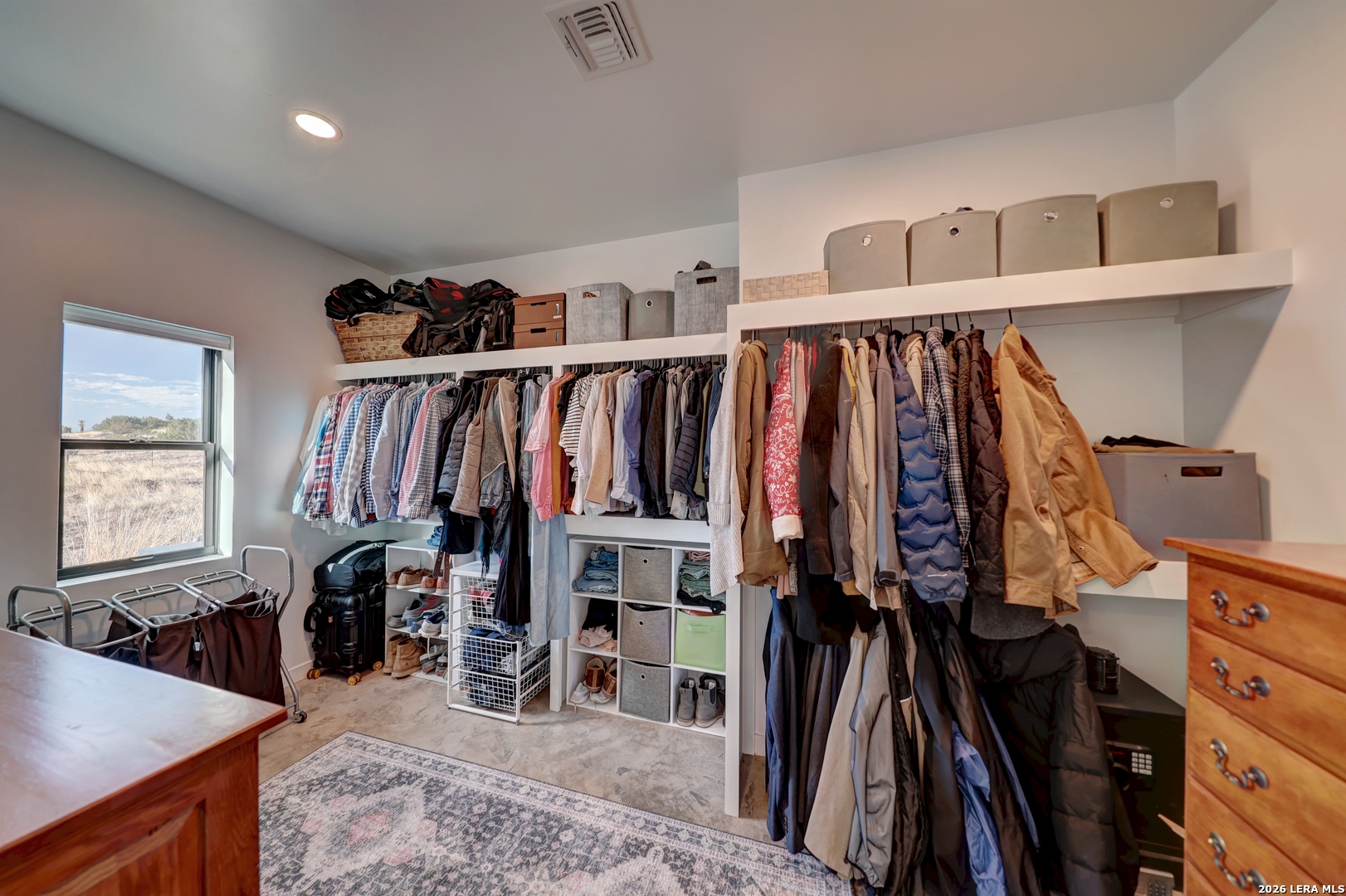 28 Scenic Ridge Road South Alpine, TX 79830 - Photo 20 of 48 a view of walk in closet with clothes and shoes