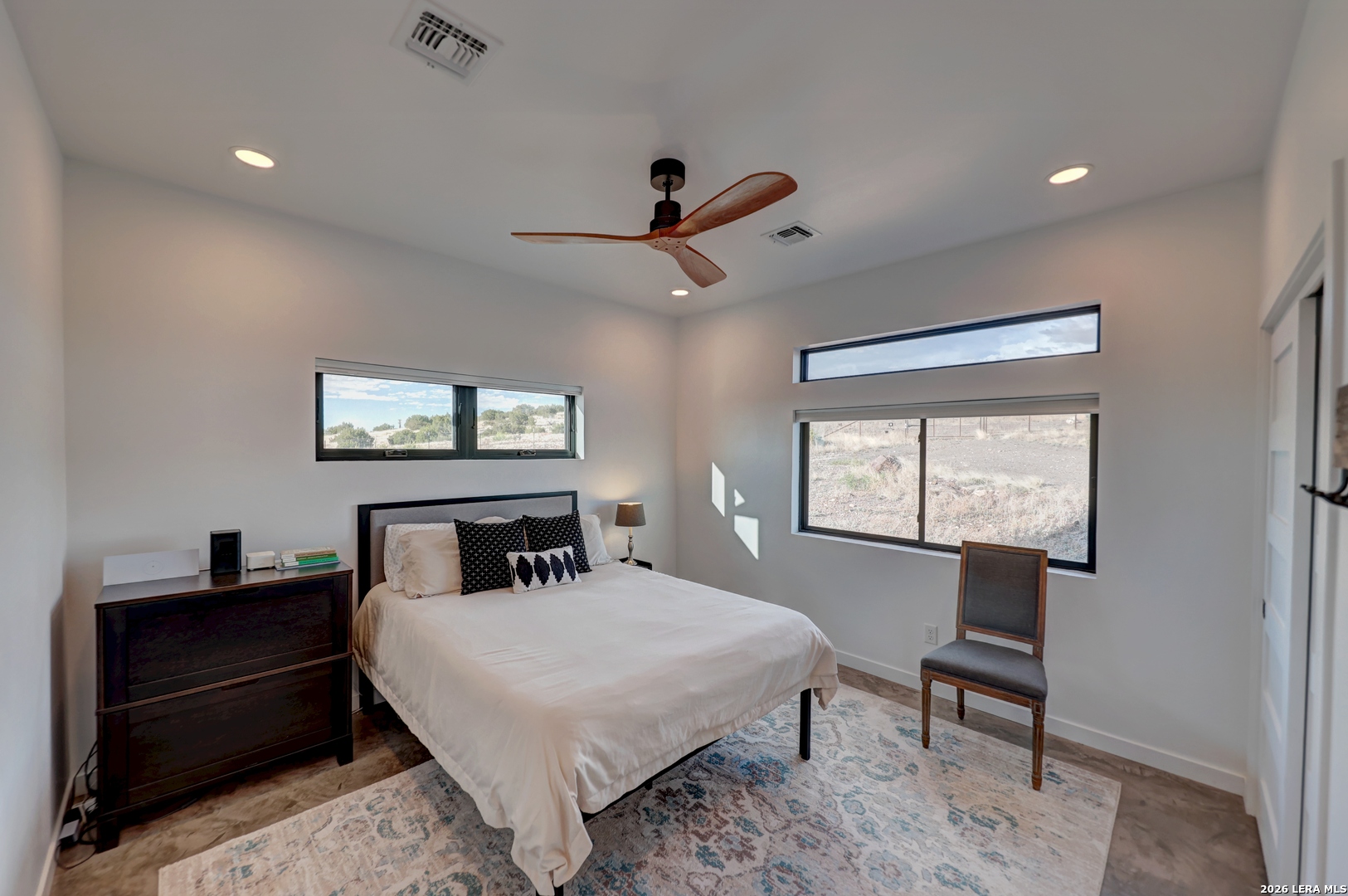 28 Scenic Ridge Road South Alpine, TX 79830 - Photo 23 of 48 a bedroom with a bed and a table