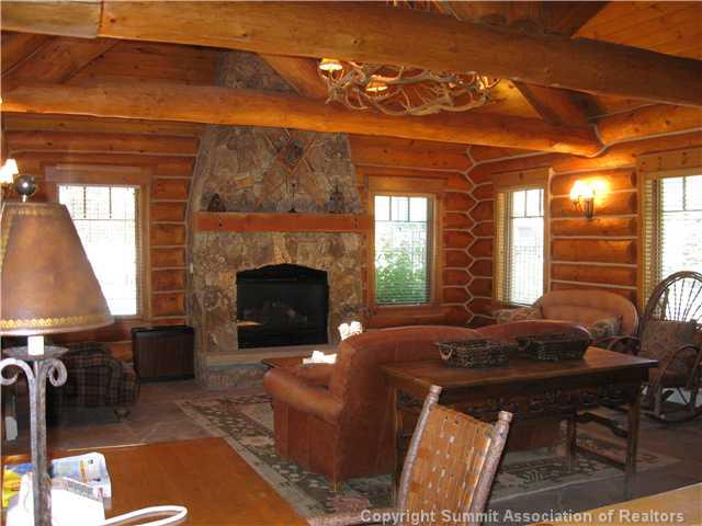 24 Wolf Rock Road Keystone, CO 80435 - Photo 5 of 8 a living room with furniture a fireplace and a table