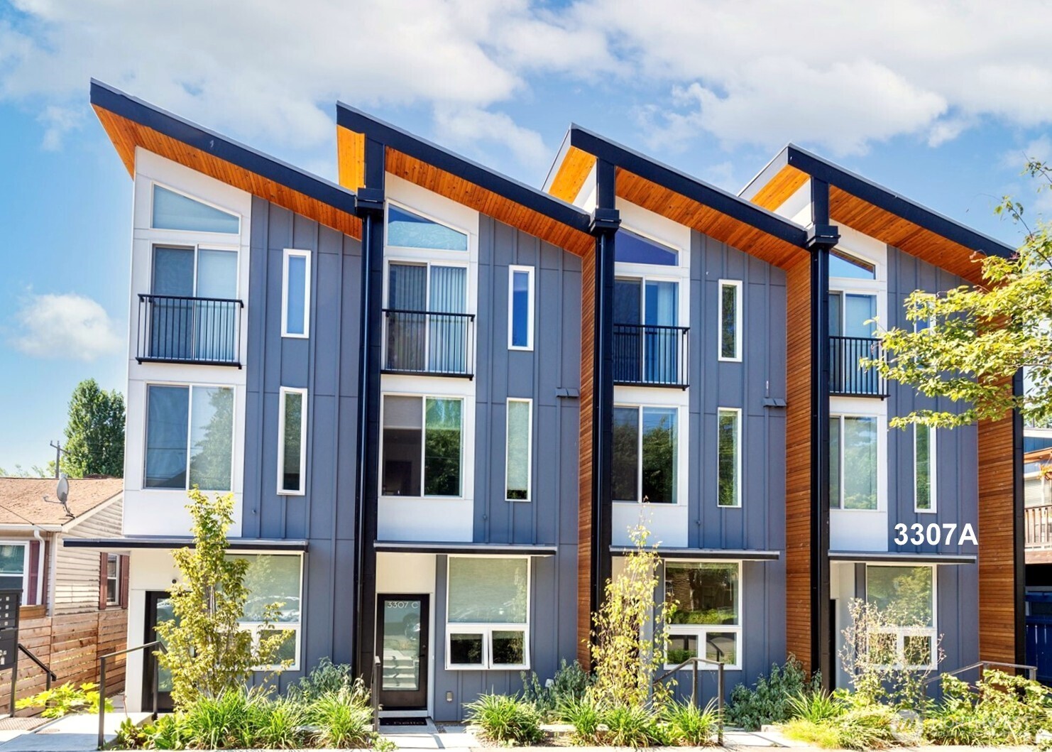 3307 Wetmore Avenue South, Unit A Seattle, WA 98144 - Photo 1 of 24 a front view of a multi story residential apartment building