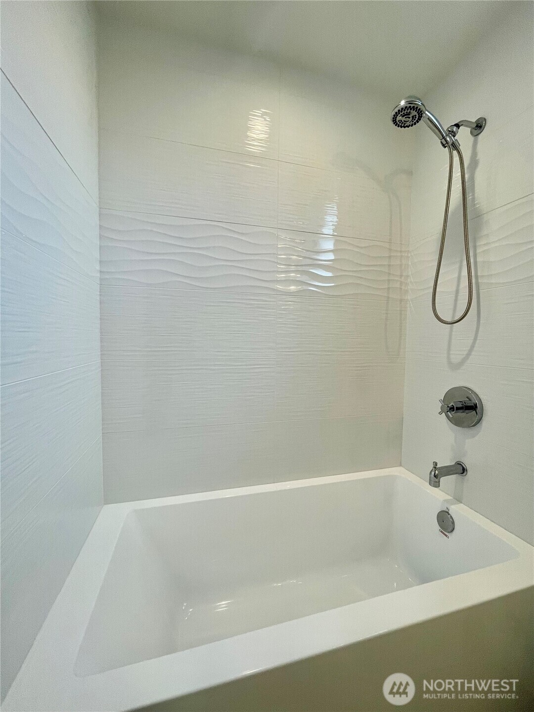 3307 Wetmore Avenue South, Unit A Seattle, WA 98144 - Photo 12 of 24 a bathroom with a bath tub with a shower