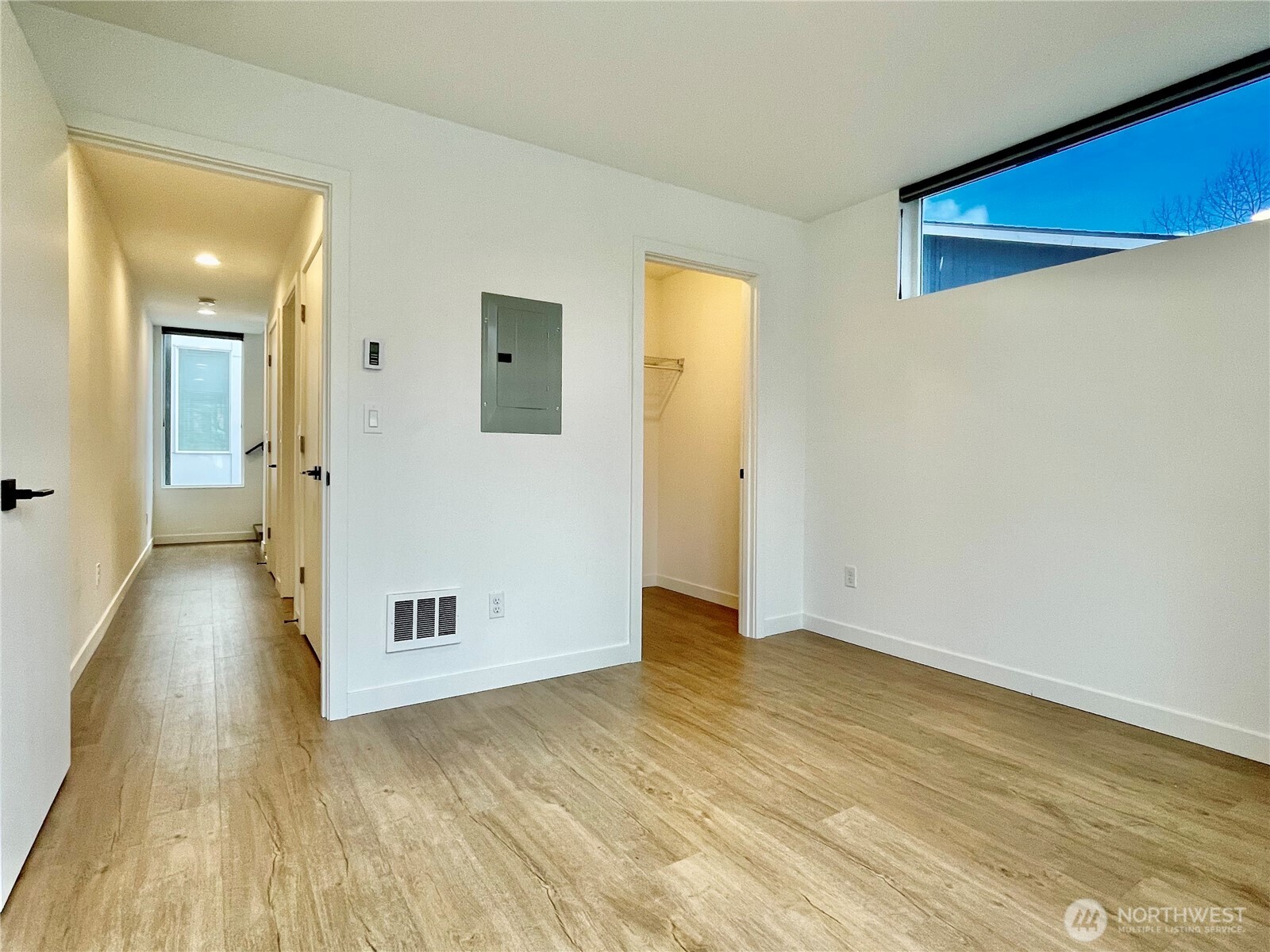 3307 Wetmore Avenue South, Unit A Seattle, WA 98144 - Photo 13 of 24 an empty room with wooden floor and windows