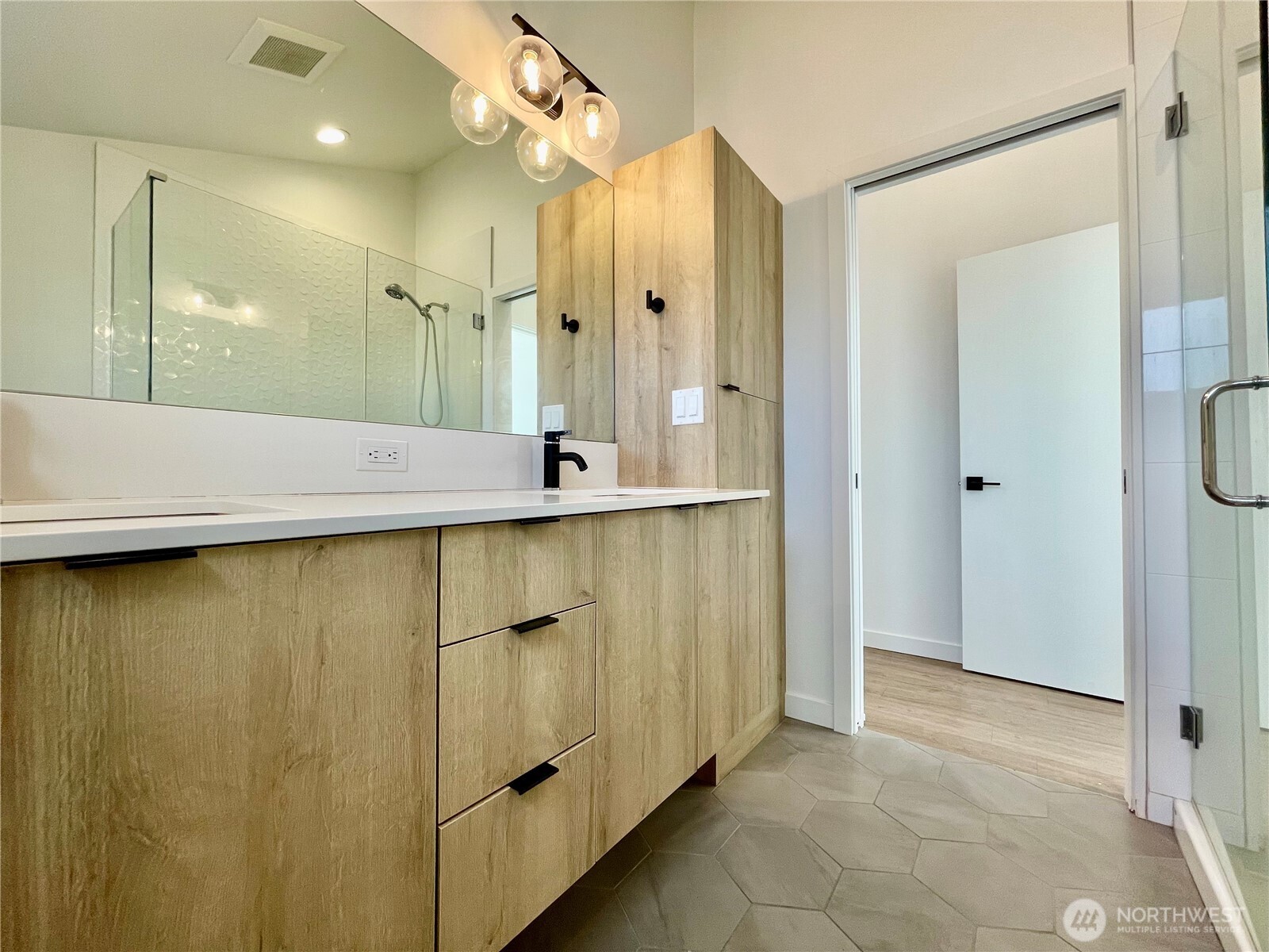 3307 Wetmore Avenue South, Unit A Seattle, WA 98144 - Photo 19 of 24 a bathroom with a granite countertop sink and a mirror