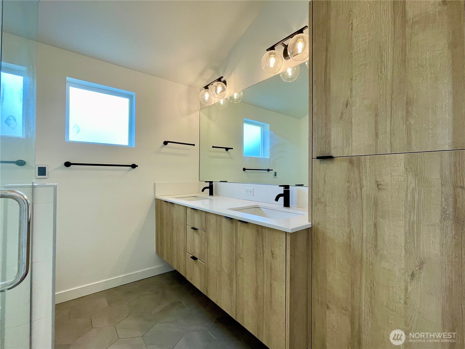 3307 Wetmore Avenue South, Unit A Seattle, WA 98144 - Photo 20 of 24 a bathroom with a sink a mirror and a shower