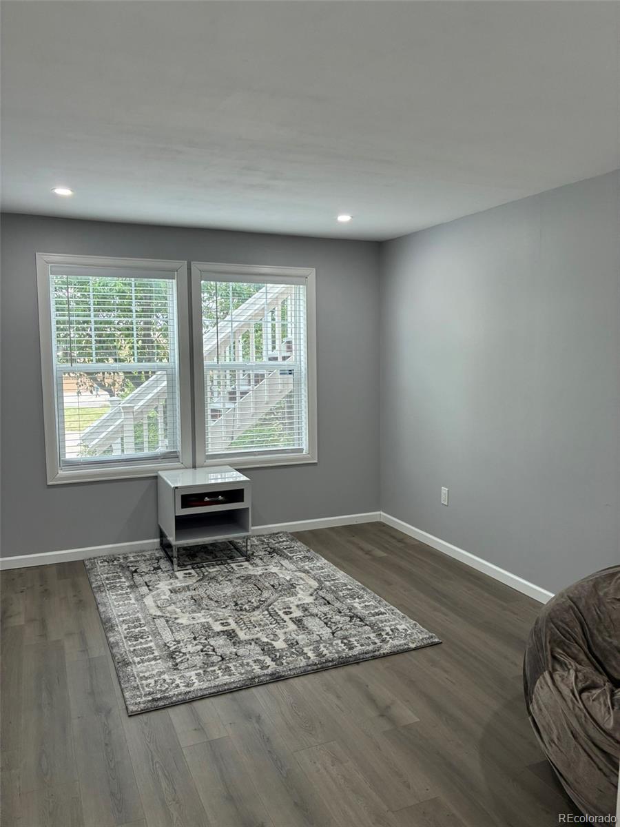 7242 South Rome Street Aurora, CO 80016 - Photo 21 of 33 a view of an empty room and window